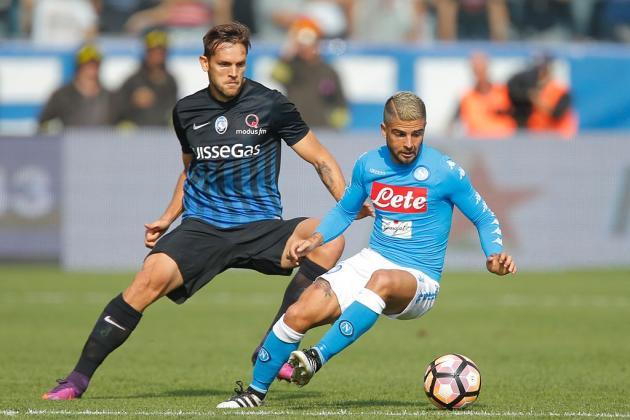 Napoli forward Lorenzo Insigne tries dribbling past Atalanta defender Rafael Toloi. (Getty Images)