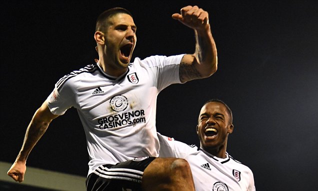 Fulham striker Aleksandr Mitrovic celebrates with Ryan Sessegnon after scoring against Sheffield United. (Getty Images)