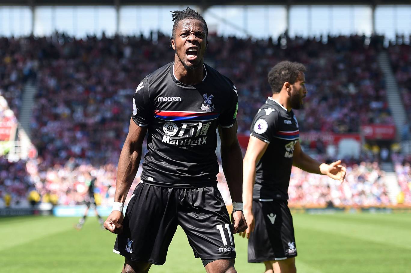 Crystal Palace forward Wilfried Zaha celebrates after scoring. (Getty Images)