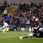 Everton forward Richarlison curls the ball past Wolves goalkeeper Rui Patricio. (Getty Images)