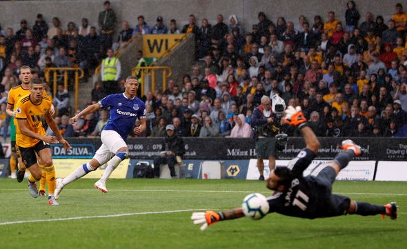Everton forward Richarlison curls the ball past Wolves goalkeeper Rui Patricio. (Getty Images)