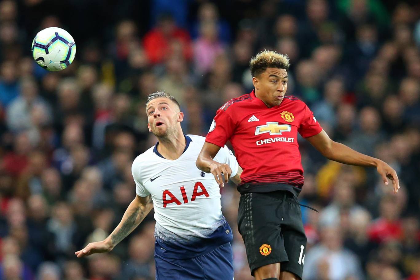 Tottenham's Toby Alderweireld challenges for the ball in the air with Manchester United's Jesse Lingard. (Getty Images)