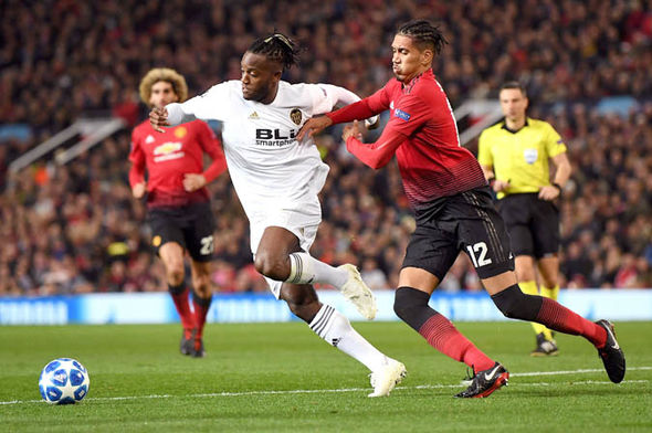 Manchester United's Chris Smalling battles with Valencia's Michy Batshuayi for the ball. (Getty Images)