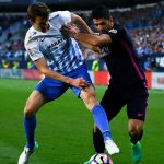 Real Sociedad defender Diego Llorente protects the ball against Barcelona striker Luis Suarez. (Getty Images)