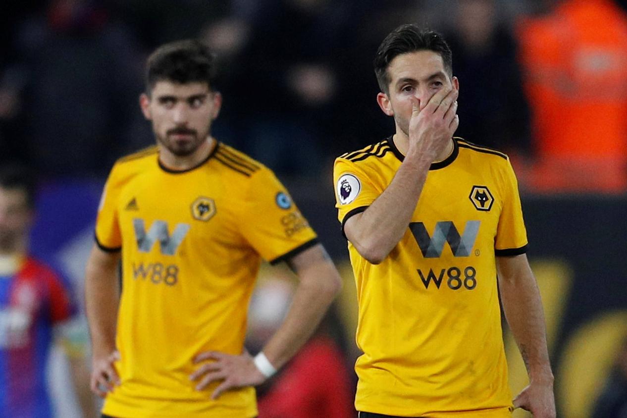 Wolves midfielders Joao Moutinho and Ruben Neves look disappointed. (Getty Images)