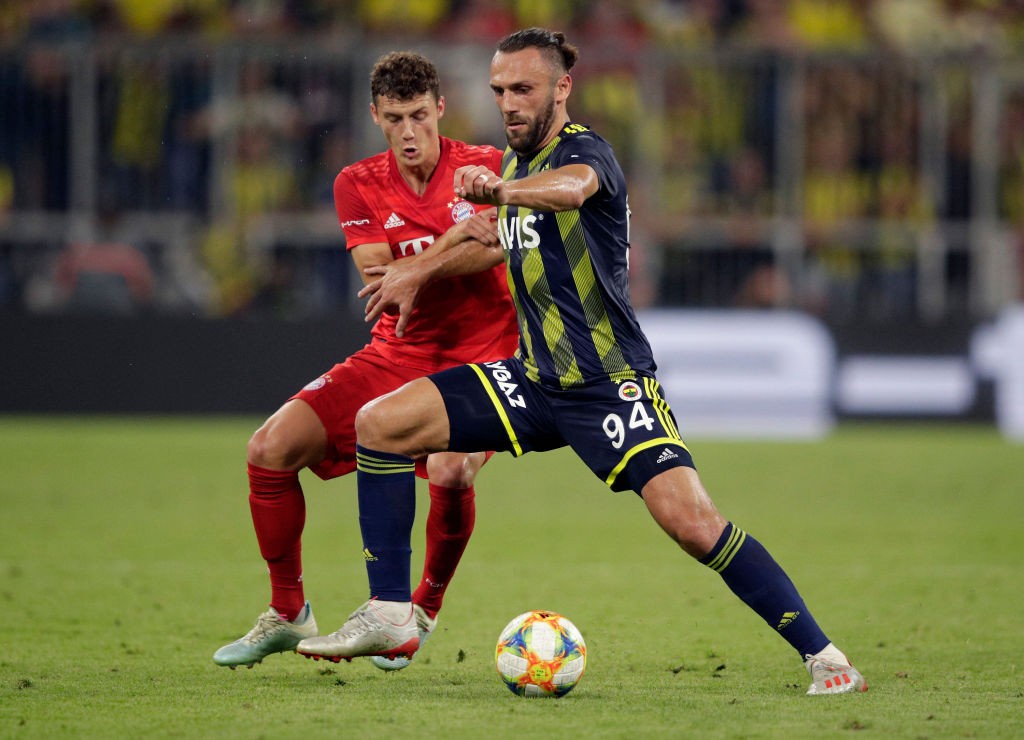 Fenerbahce striker Vedat Muriqi protects the ball from Bayern Munich defender Benjamin Pavard. (Getty Images)