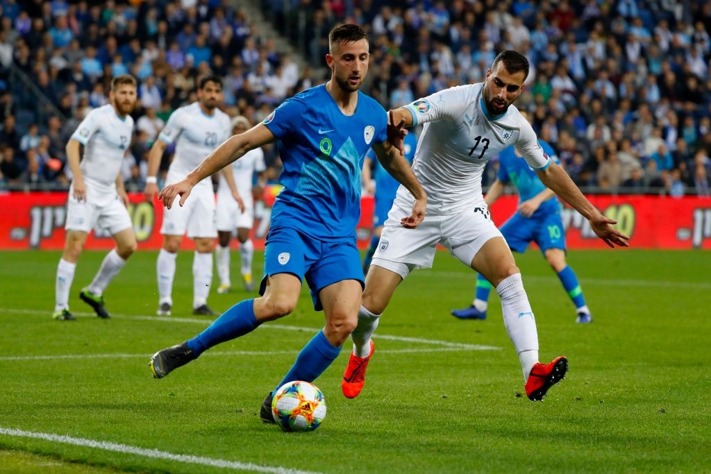 Slovenia's forward Andraz Sporar is marked by Israel's defender Loai Taha (R) during the Euro 2020 Group G football qualification match between Israel and Slovenia in at the Sammy Ofer Stadium in Haifa on March 21, 2019. (Getty Images)