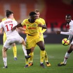 Enock Kwateng of Nantes is tackled by Aleksandr Golovin of Monaco during the Ligue 1 match between AS Monaco and FC Nantes at Stade Louis II on February 16, 2019 in Monaco. (Getty Images)