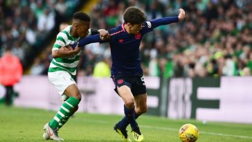 Aaron Hickey of Hearts holds off Karamoko Dembele of Celtic during the Ladbrokes Scottish Premiership match between Celtic and Hearts at Celtic Park on May 19, 2019 in Glasgow, Scotland. (Getty Images)