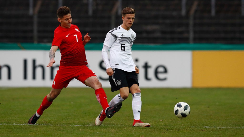 Dzenis Burnic of Germany challenges Patryk Klimala of Poland during the international friendly match between U20 Germany and U20 Poland at Energieversum Stadion im Heidewald on March 27, 2018 in Guetersloh, Germany. (Getty Images)