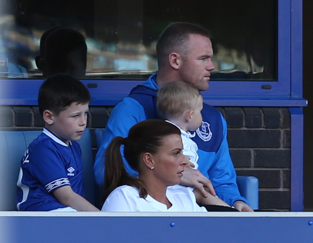 Wayne Rooney with his wife and children