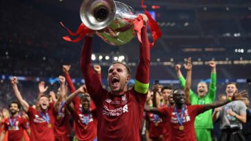 Jordan Henderson of Liverpool lifts the Champions League Trophy. (Photo by Matthias Hangst/Getty Images)