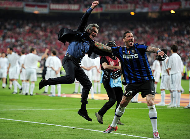 Head coach Jose Mourinho (L) and Marco Materazzi of Inter Milan celebrate their team's victory at the end of the UEFA Champions League Final.  (Photo by Shaun Botterill/Getty Images)