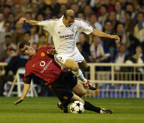 Zinedine Zidane of Real Madrid jumps over a tackle from Roy Keane of Manchester United during the UEFA Champions League quarter-final. (Photo by Shaun Botterill/Getty Images)