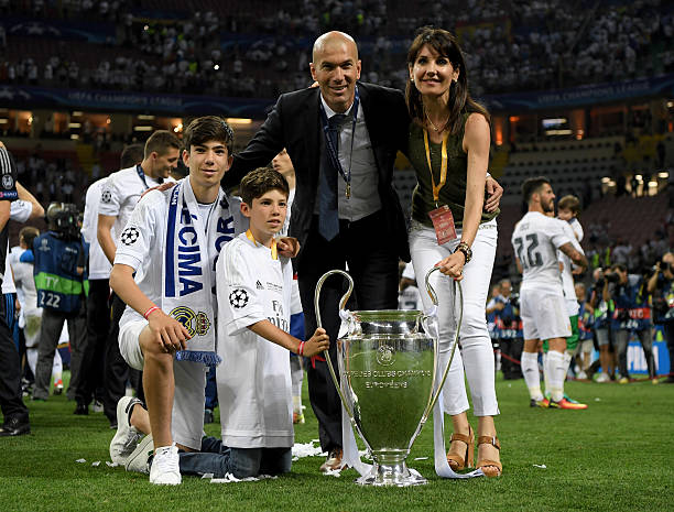 MILAN, ITALY - MAY 28: Real Madrid head coach Zinedine Zidane poses with the trophy and his family and wife Veronique Zidane. (Photo by Matthias Hangst/Getty Images)