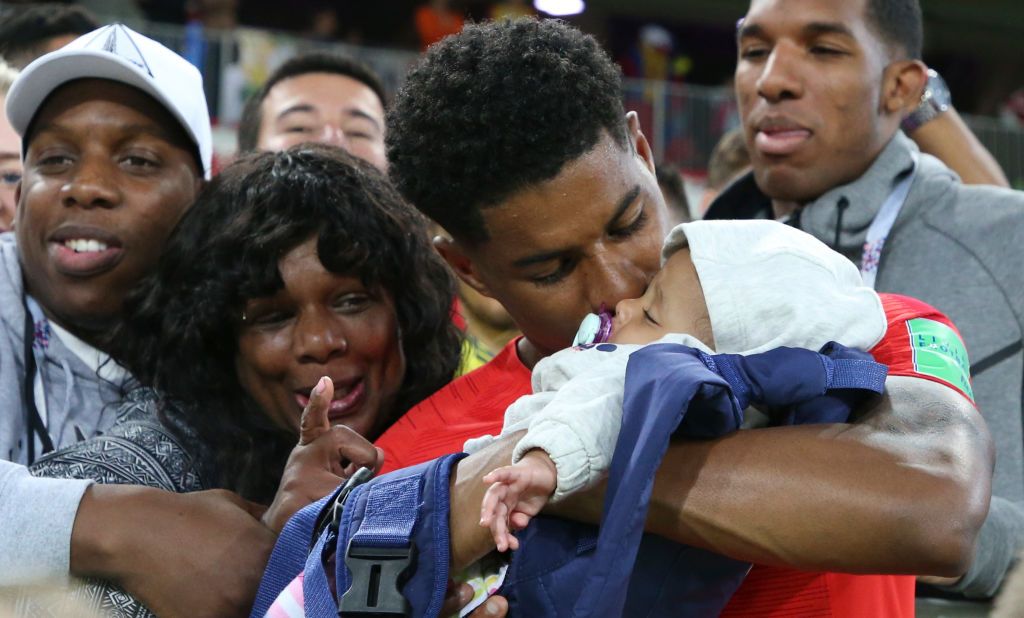 Marcus Rashford with his family after a 2018 World Cup match. (Credit: Pinterest) 
