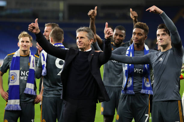 Claude Puel, Manager of Leicester City, Demarai Gray of Leicester City and Ben Chilwell of Leicester City acknowledge the fans after the Premier League match between Cardiff City and Leicester City at Cardiff City Stadium 