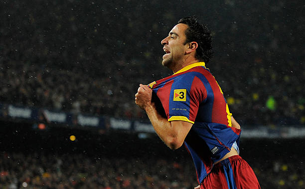   Xavi Hernandez of Barcelna celebrates after scoring the first goal during the La Liga match between Barcelona and Real Madrid at the Camp Nou Stadium on November 29, 2010 in Barcelona, Spain.  Barcelona won the match 5-0. 