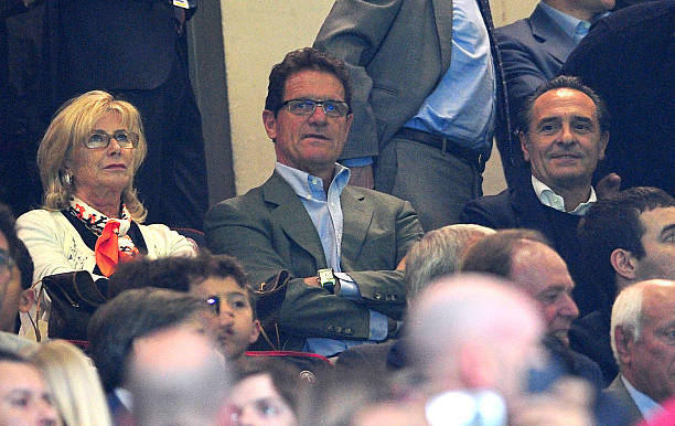 Former England's football team coach Fabio capello (C), his wife Laura (L) and Italy's national team coach cesare Prandelli take place for the Champions League quarter-finals first leg football match.