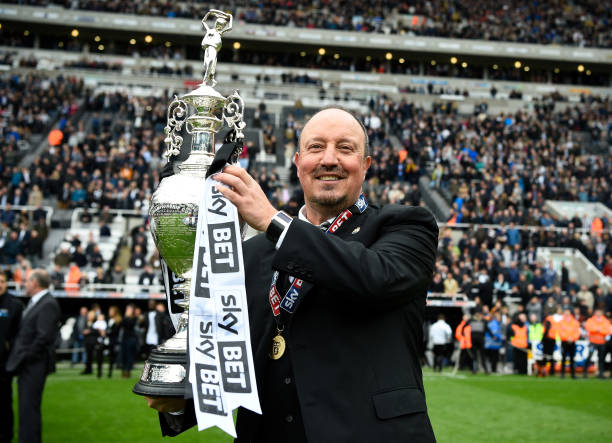 Rafael Benitez, Manager of Newcastle United celebrates with the Championship trophy after the Sky Bet Championship match between Newcastle United and Barnsley at St James' Park 