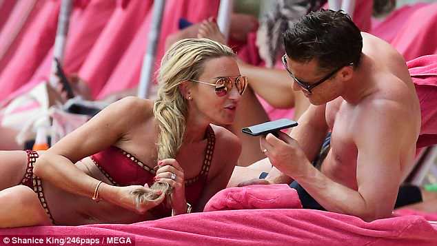 Scott Parker with his wife Carley Parker enjoying in beach