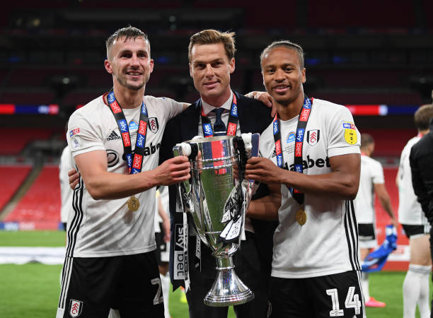  Scott Parker manager of Fulham, Joe Bryan and Bobby Decordova-Reid of Fulham celebrate with the trophy after  the Sky Bet Championship Play Off Final match between Brentford and Fulham at Wembley Stadium on August 04, 2020 in London, England.