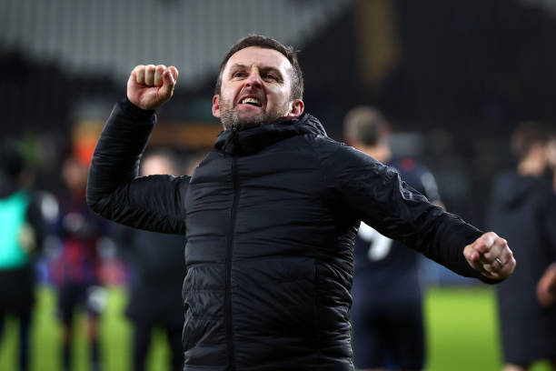 Luton Manager Nathan Jones celebrates with the fans after his team won the Sky Bet Championship match between Swansea City and Luton Town at Swansea.com Stadium on February 01, 2022 in Swansea, Wales.