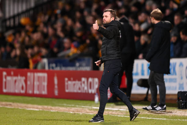 Nathan Jones, Manager of Luton Town gives their team instructions during the Emirates FA Cup Fourth Round match between Cambridge United and Luton Town