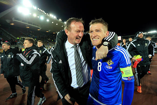  Northern Ireland Manager Michael O'Neill and Captain Steven Davis celebrate after the UEFA EURO 2016 Qualifying match between Finland and Northern Ireland at the Olympic Stadium on October 11, 2015 in Helsinki, Finland