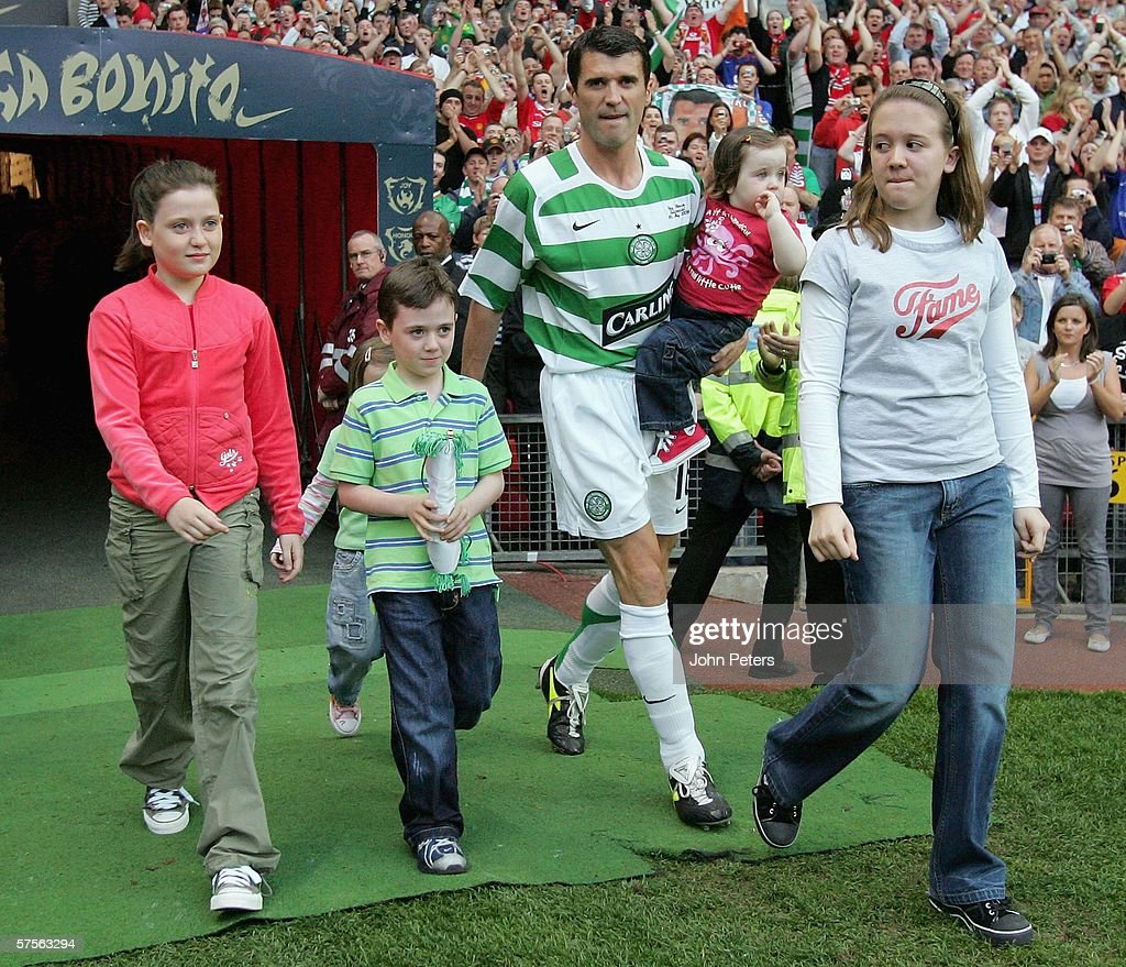 Roy Keane walks out with his children ahead of his testimonial match between Manchester United and Glasgow Celtic at Old Trafford. (Photo by John Peters/Manchester United via Getty Images)