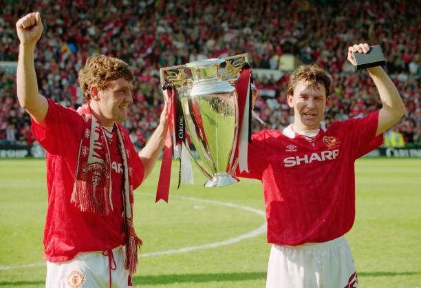  Manchester United players Steve Bruce (l) and Bryan Robson hold aloft the inaugural Premiership Trophy after a goalless draw with Coventry City at Old Trafford on May 8, 1994 