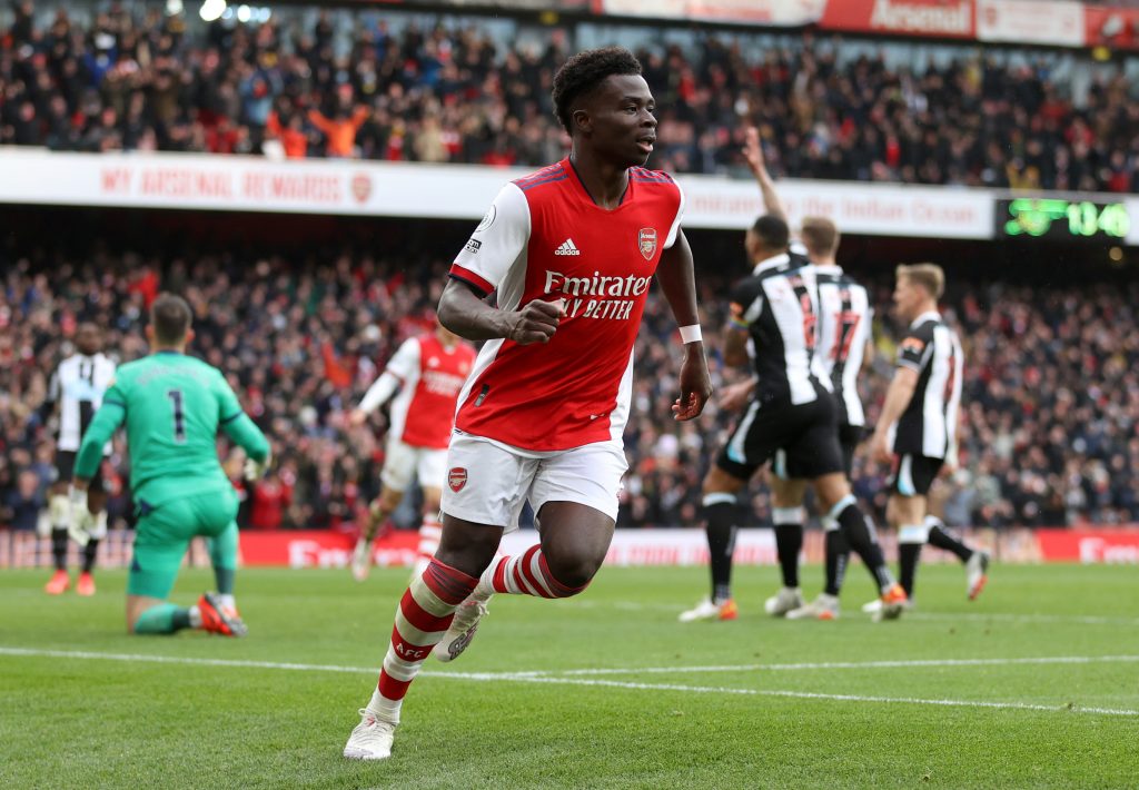 Bukayo Saka of Arsenal celebrates after scoring their team's first goal during the Premier League match between Arsenal and Newcastle United. (Photo by Richard Heathcote/Getty Images)