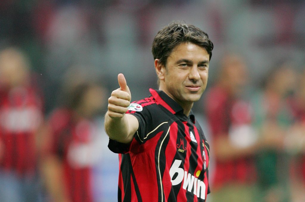 Alessandro Costacurta (C) salutes his supporters as he leaves the field at the and of his last match. (Photo credit should read ANDREAS SOLARO/AFP/Getty Images)