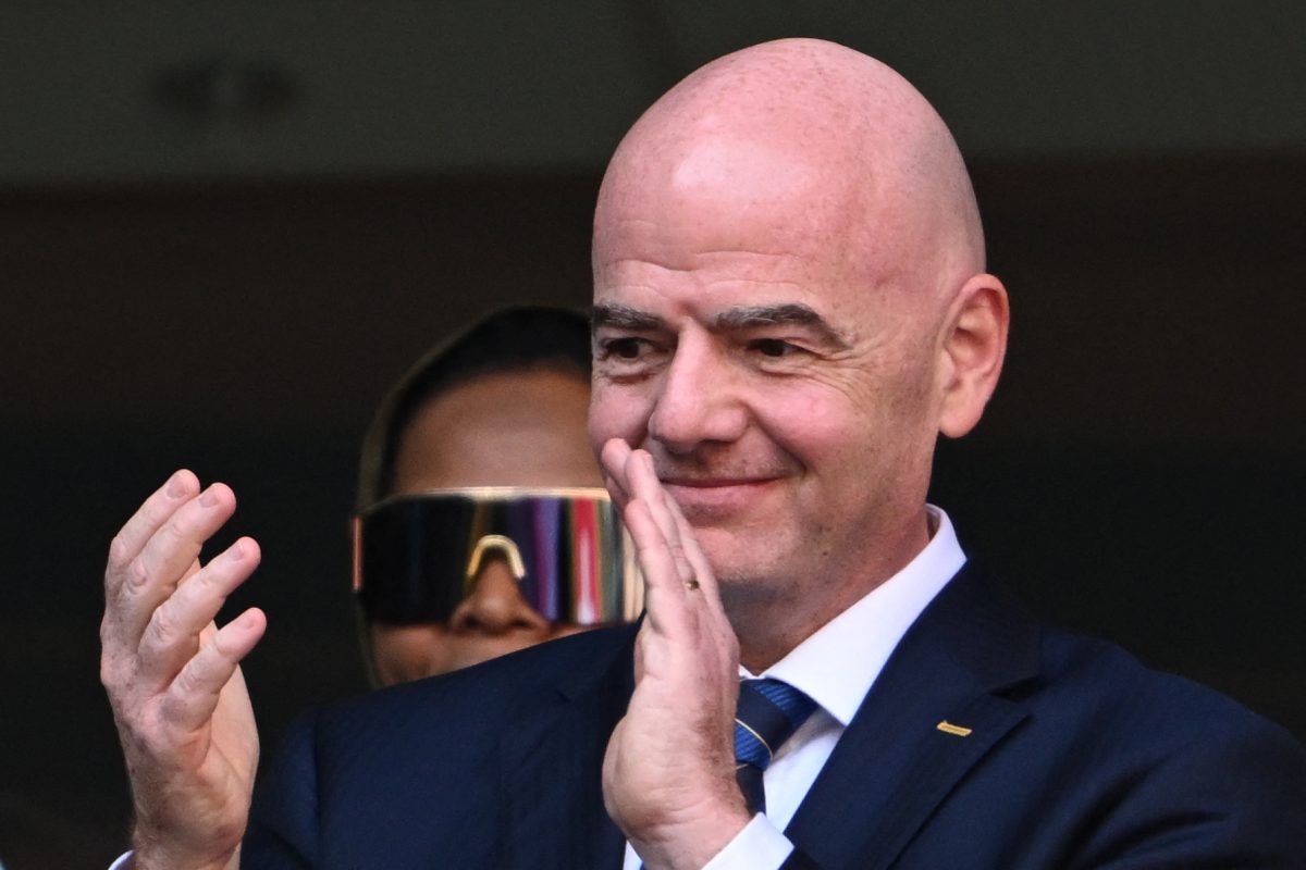 FIFA President Gianni Infantino applauds players ahead of the Qatar 2022 World Cup Group G football match between Switzerland and Cameroon. (Photo by FABRICE COFFRINI/AFP via Getty Images)