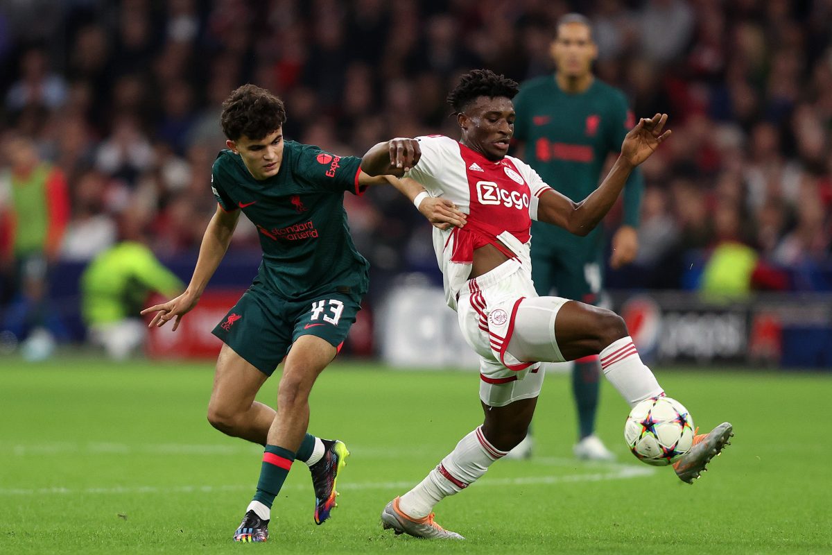 Stefan Bajcetic of Liverpool during the UEFA Champions League match tackling Mohammed Kudus of Ajax. (Photo by Dean Mouhtaropoulos/Getty Images)
