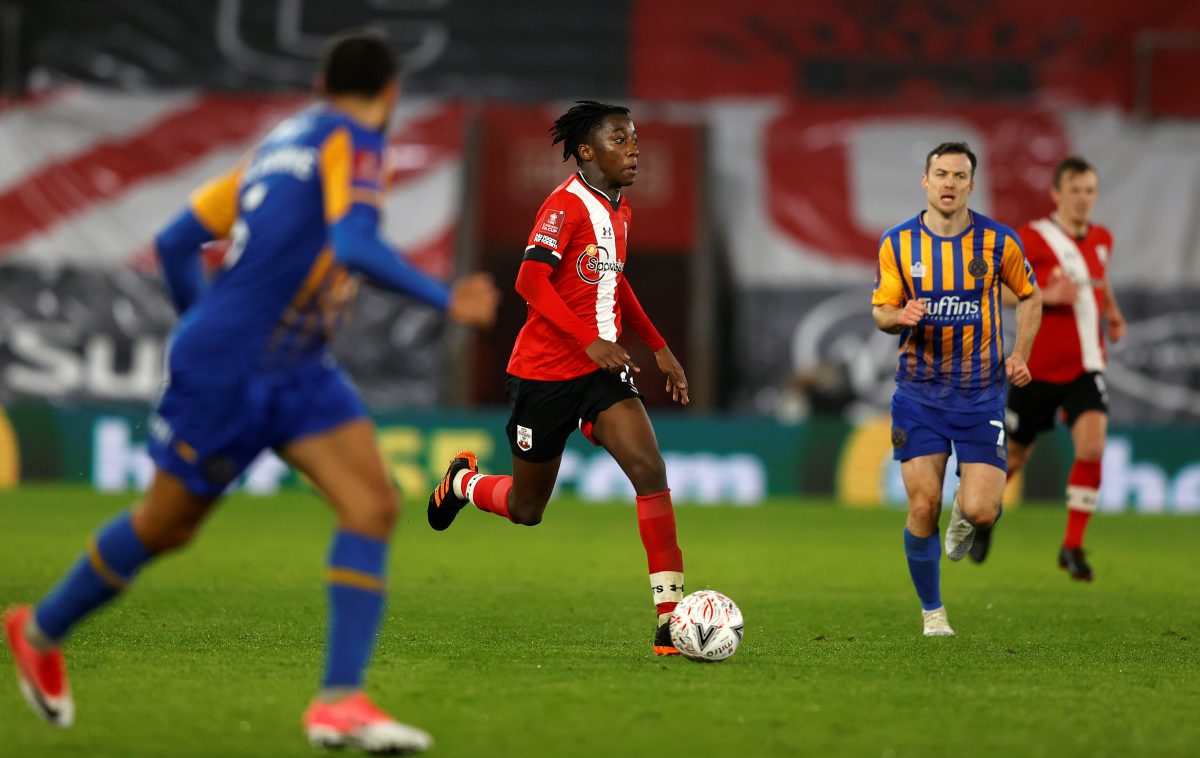 Southampton's English midfielder Kgaogelo Chauke (C) runs with the ball during the English FA Cup football third round match between Southampton and Shrewsbury Town at St Mary's Stadium in Southampton, southern England on January 19, 2021. (Photo by Adrian DENNIS / POOL / AFP)