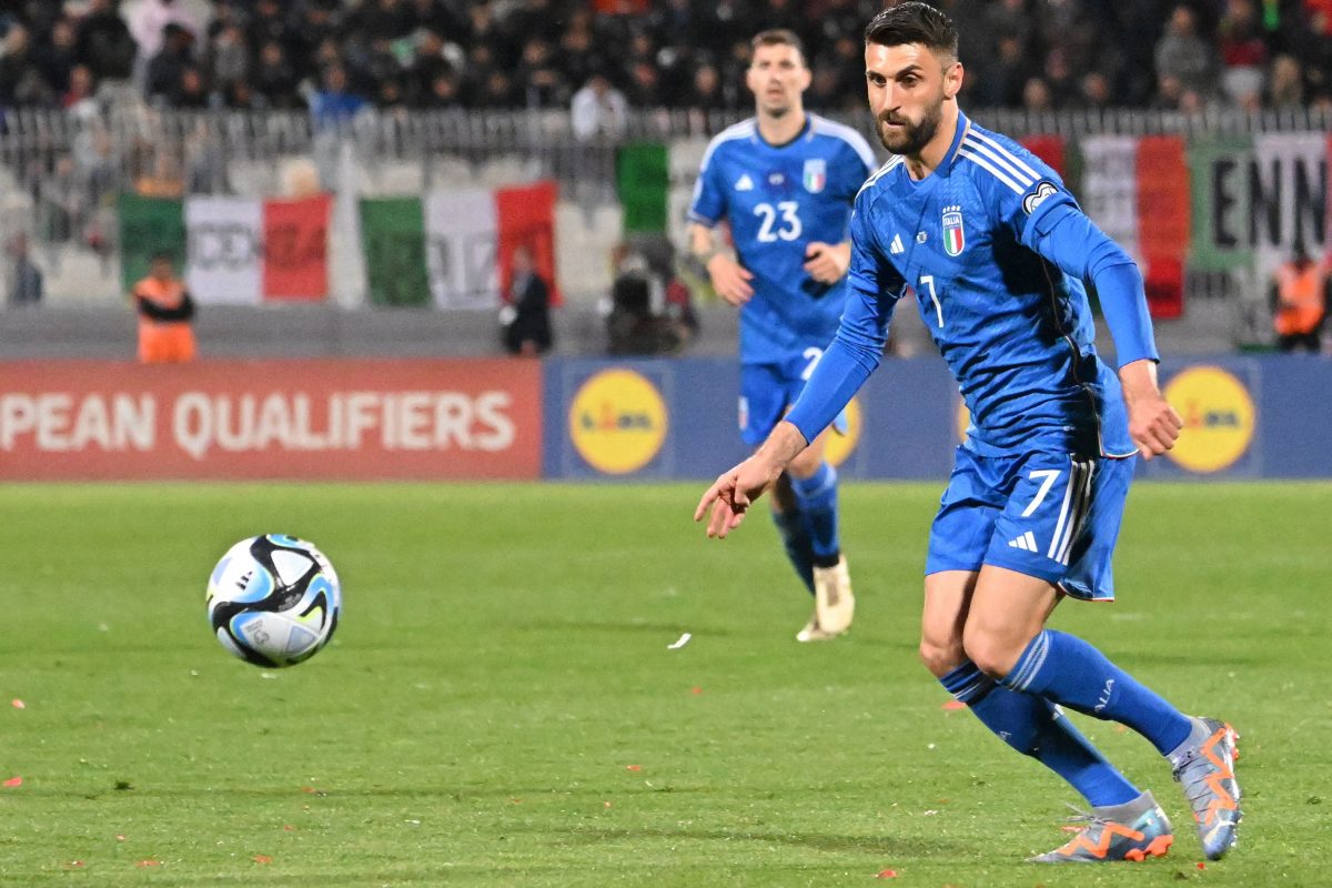 Italy's forward Vincenzo Grifo (R) runs with the ball during the UEFA Euro 2024 Group C qualification match between Malta and Italy. (Photo by ALBERTO PIZZOLI/AFP via Getty Images)