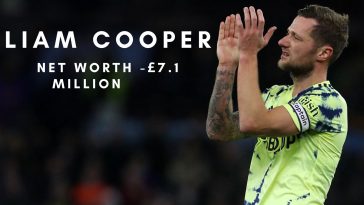 Leeds United's English-born Scottish defender Liam Cooper applauds fans.