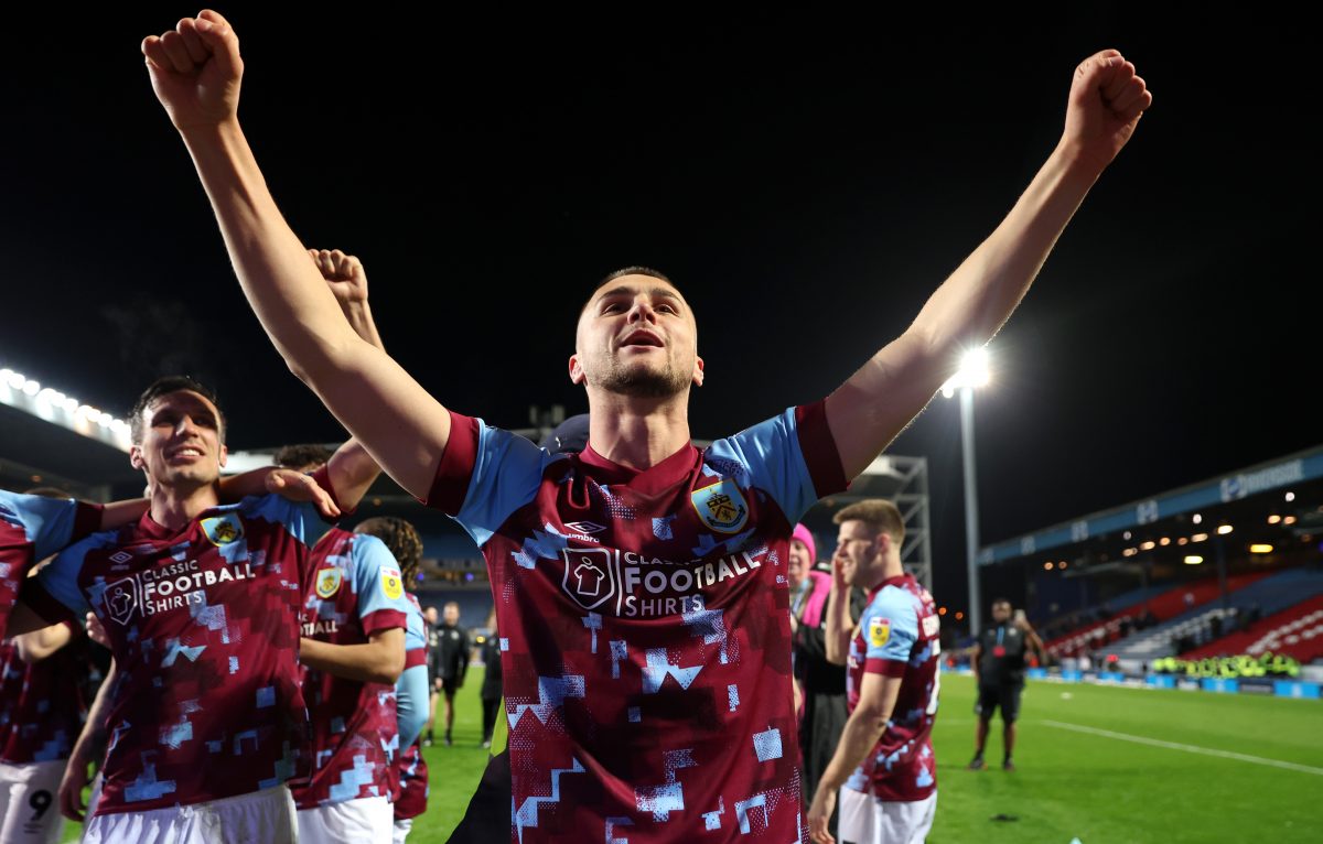Taylor Harwood-Bellis of Burnley celebrates after winning the Sky Bet Championship following victory against Blackburn Rovers and Burnley. (Photo by Matt McNulty/Getty Images)
