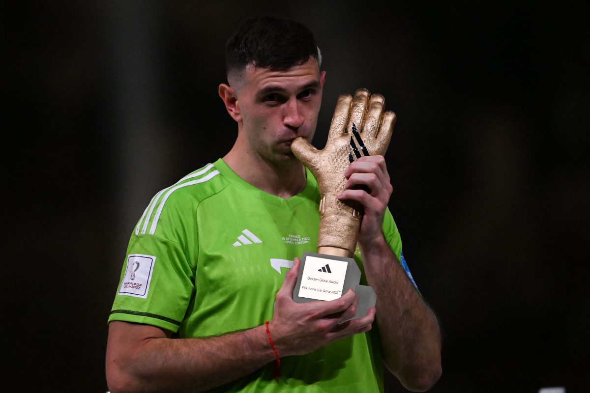 Martinez with the 2022 FIFA World Cup's Golden Glove award. (Photo by KIRILL KUDRYAVTSEV/AFP via Getty Images)