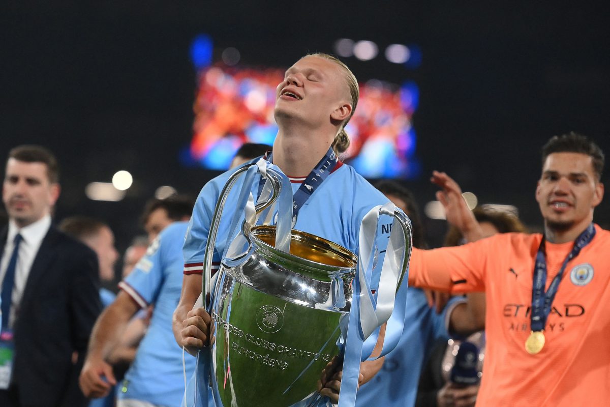 Manchester City's Norwegian striker #9 Erling Haaland celebrates with the European Cup trophy after winning the UEFA Champions League final football match between Inter Milan and Manchester City. (Photo by FRANCK FIFE/AFP via Getty Images)