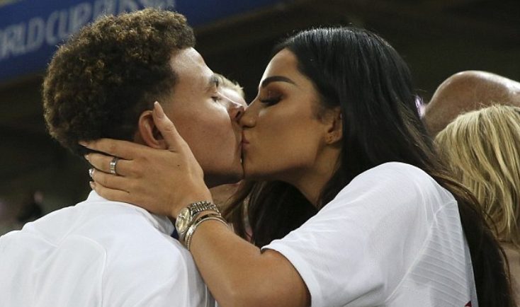 Dele Alli of England is kissed by girlfriend Ruby Mae.  (Photo by Alexander Hassenstein/Getty Images)