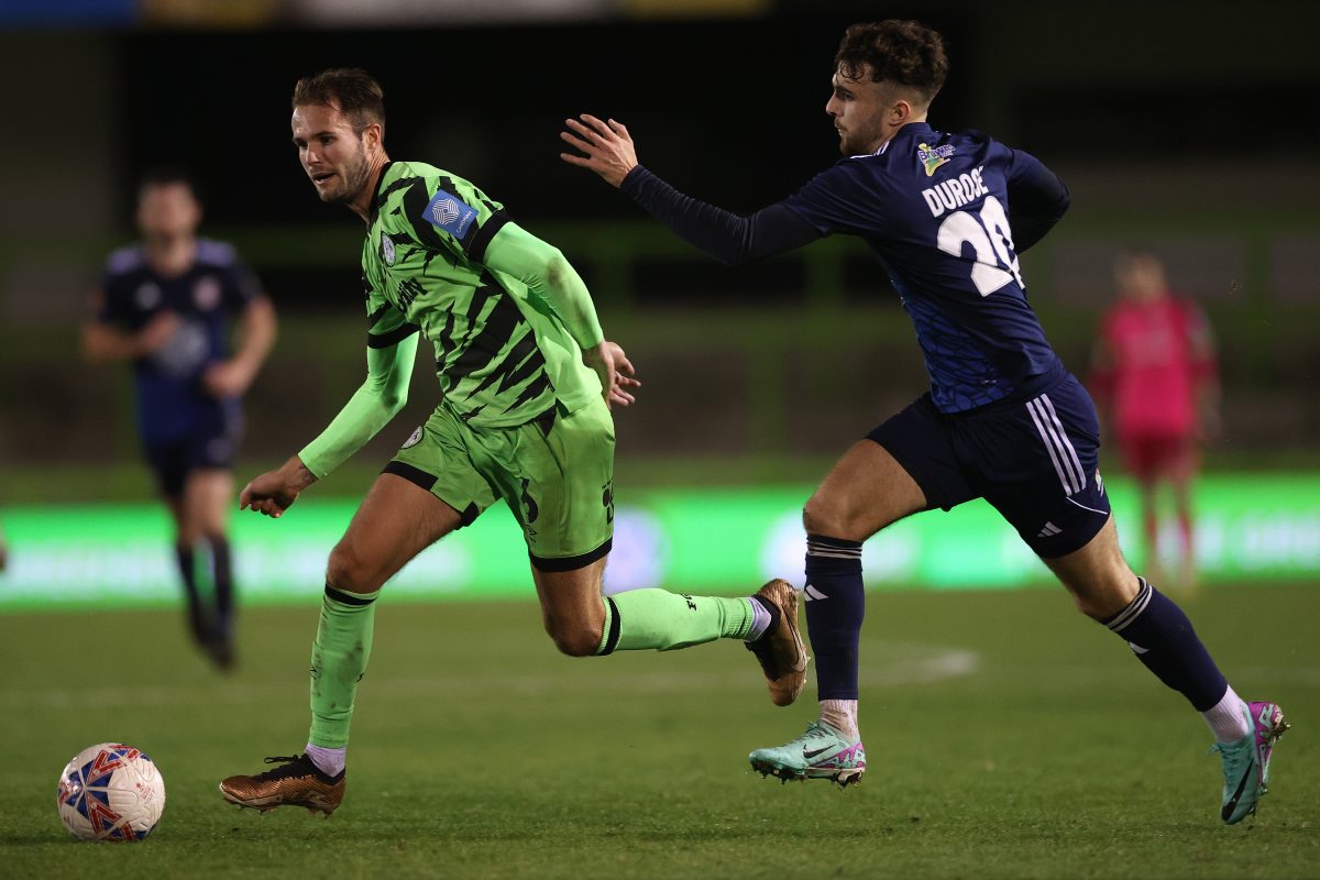 Teddy Jenks of Forest Green Rovers runs with the ball whilst under pressure from Curtis Durose. (Photo by Michael Steele/Getty Images)