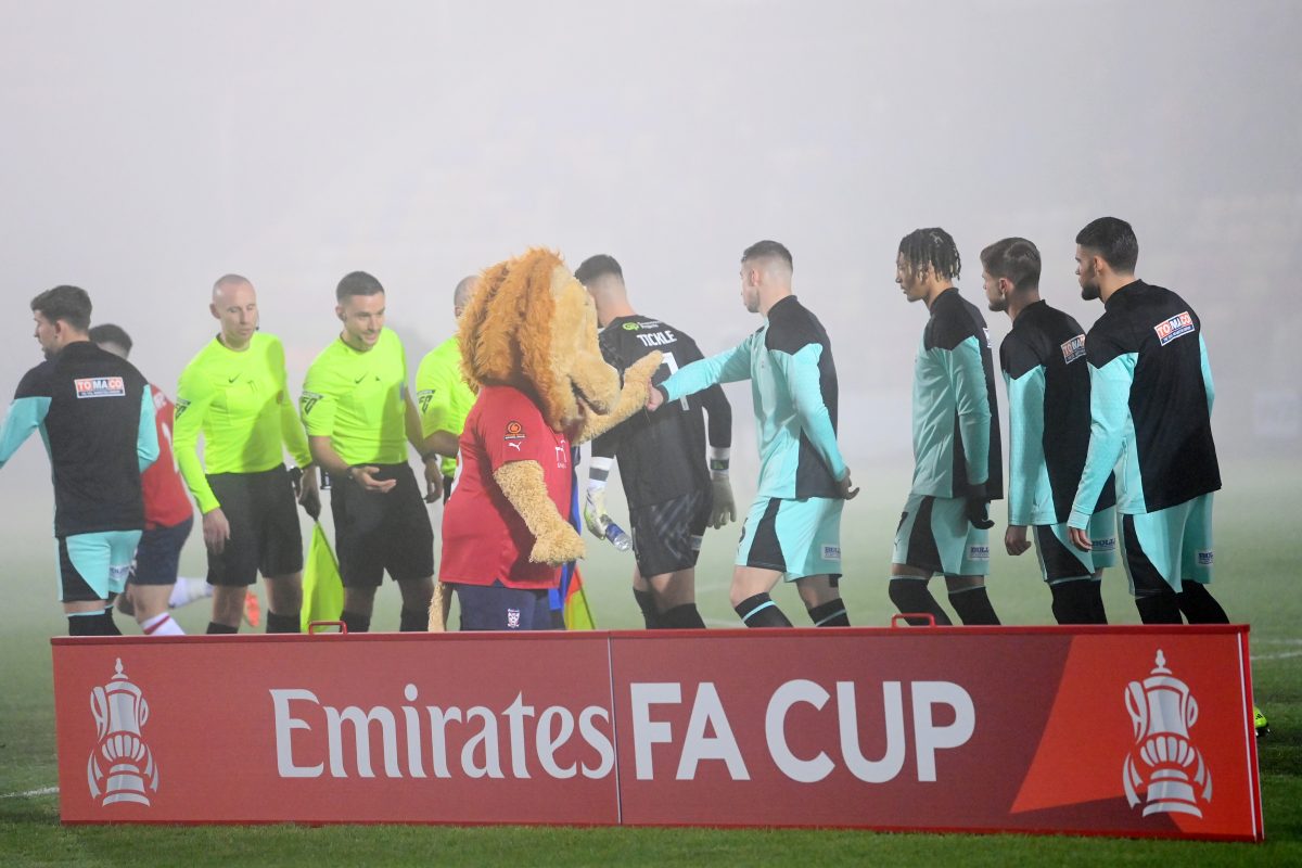 The players of Wigan Athletic shake hands with the match officials and York City club mascot, Yorkie the Lion, prior to kick-off ahead of the Emirates FA Cup Second Round match between York City and Wigan Athletic. (Photo by Stu Forster/Getty Images)