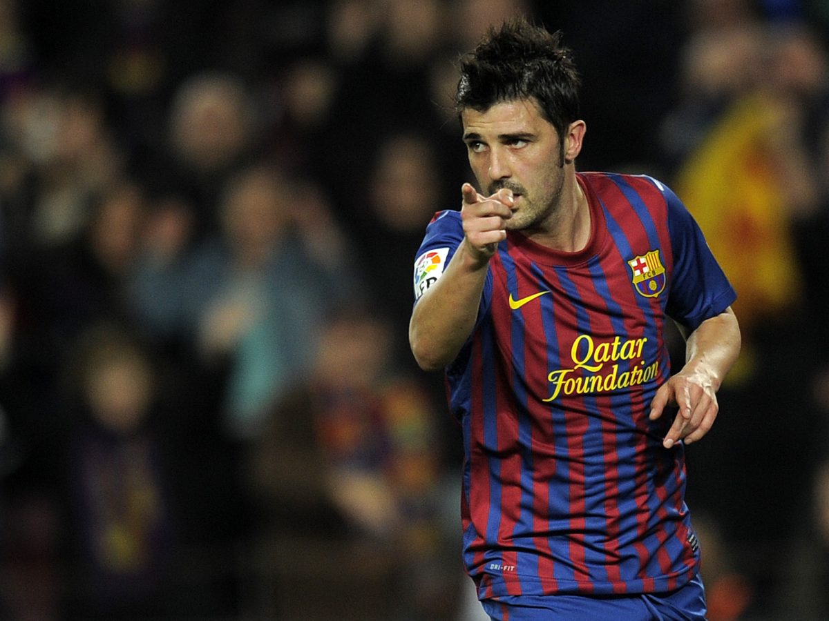 David Villa celebrates after scoring a goal during the Spanish League football match between FC Barcelona and  Rayo Vallecano. (Photo credit should read LLUIS GENE/AFP via Getty Images)