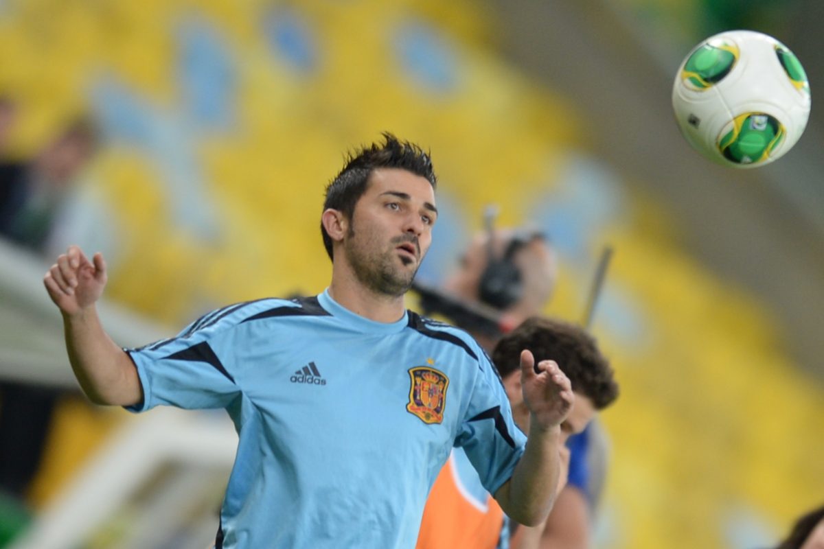 David Villa eyes the ball just before the start of a training session. (Photo credit should read VANDERLEI ALMEIDA/AFP via Getty Images)